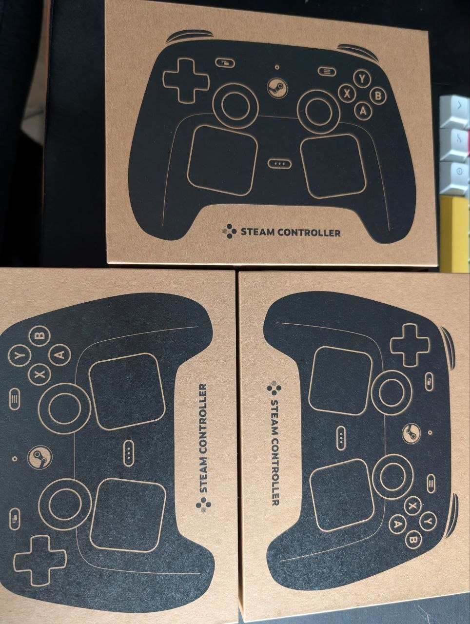 Three Steam Controller boxes
